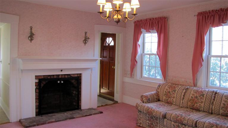 265 Chatham Road Harwich, MA 02645 - Photo 3 of 35 a living room with furniture and a fireplace