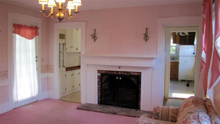 265 Chatham Road Harwich, MA 02645 - Photo 4 of 35 a living room with furniture and a fireplace