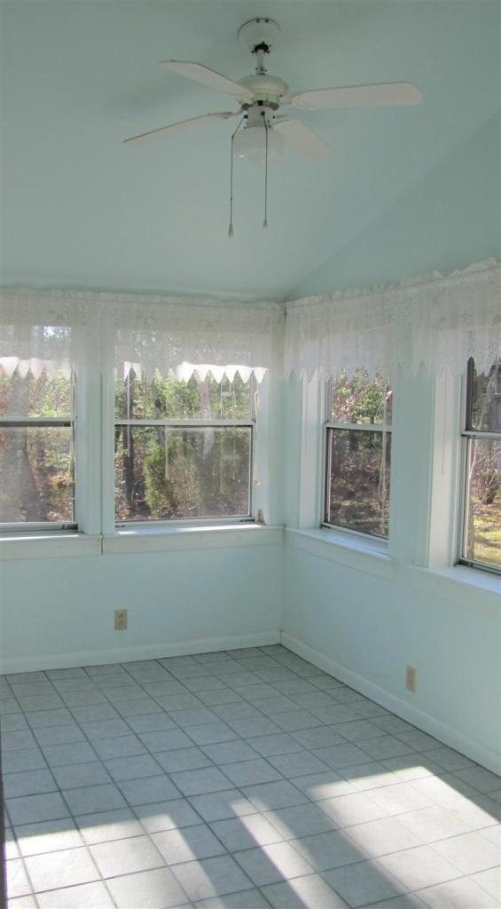 265 Chatham Road Harwich, MA 02645 - Photo 5 of 35 a view of an empty room with a window