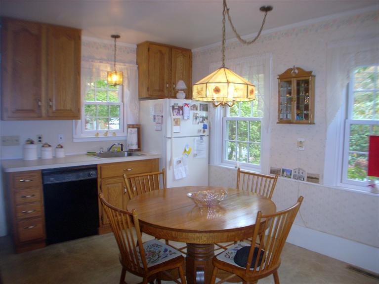 265 Chatham Road Harwich, MA 02645 - Photo 8 of 35 a view of a dining room with furniture window and outside view