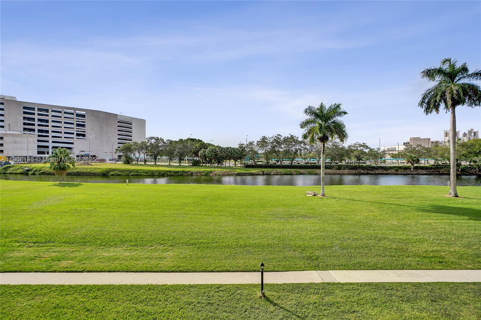8335 Southwest 72nd Avenue, Unit 205D Miami, FL 33143 - Photo 13 of 19 a view of a lake with a big yard