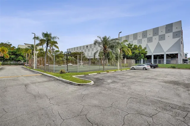 a view of a building with a palm tree