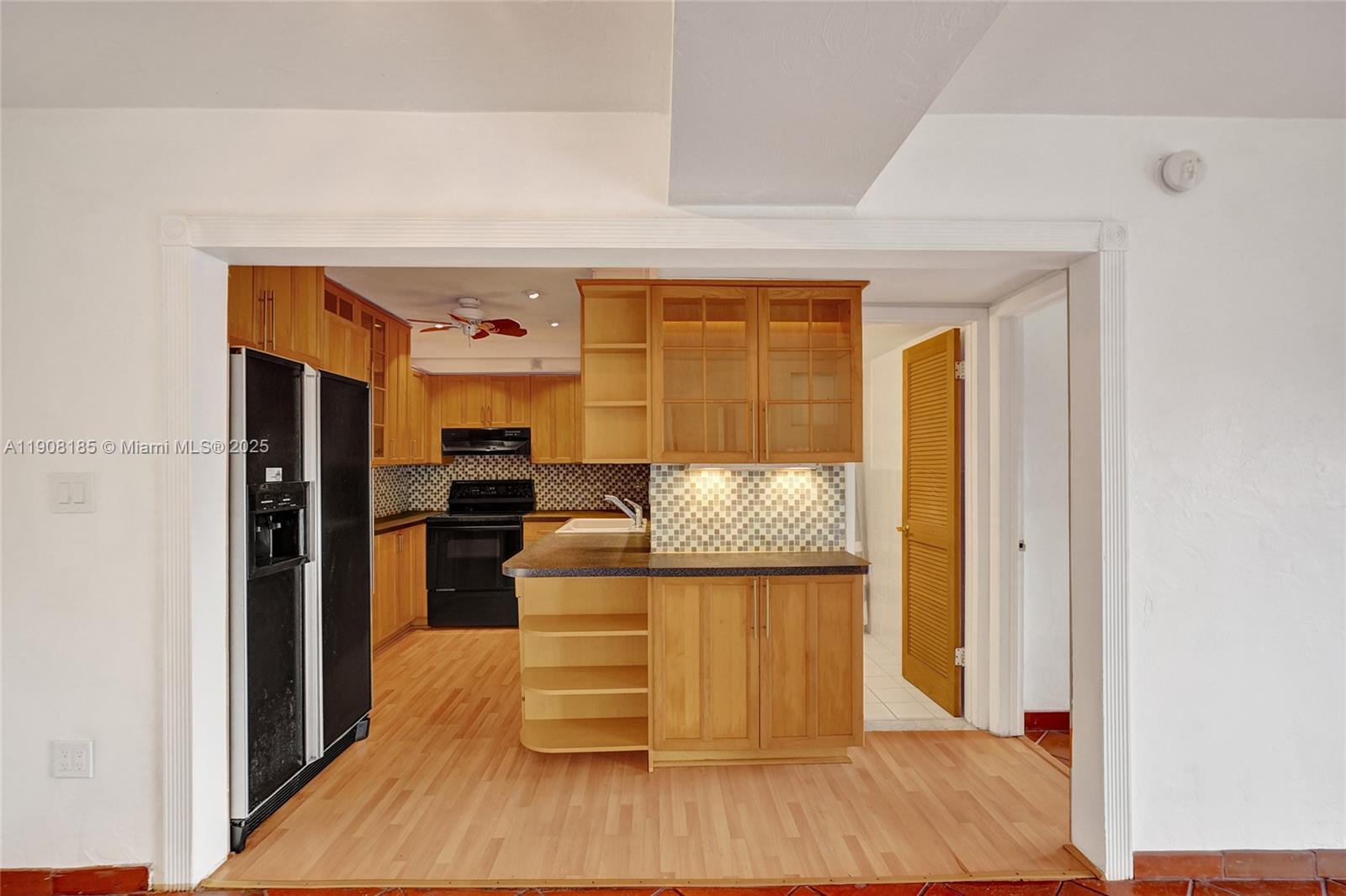 8335 Southwest 72nd Avenue, Unit 205D Miami, FL 33143 - Photo 4 of 19 a living room with furniture and a wooden floor