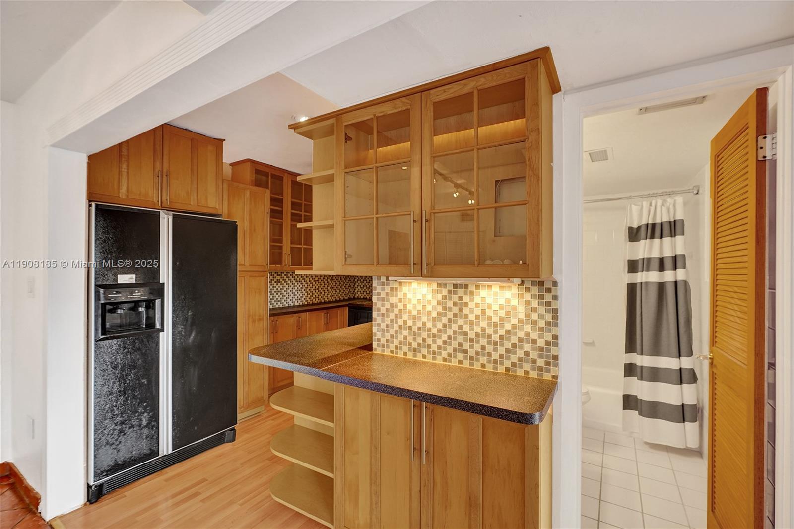 8335 Southwest 72nd Avenue, Unit 205D Miami, FL 33143 - Photo 5 of 19 a bathroom with a shower