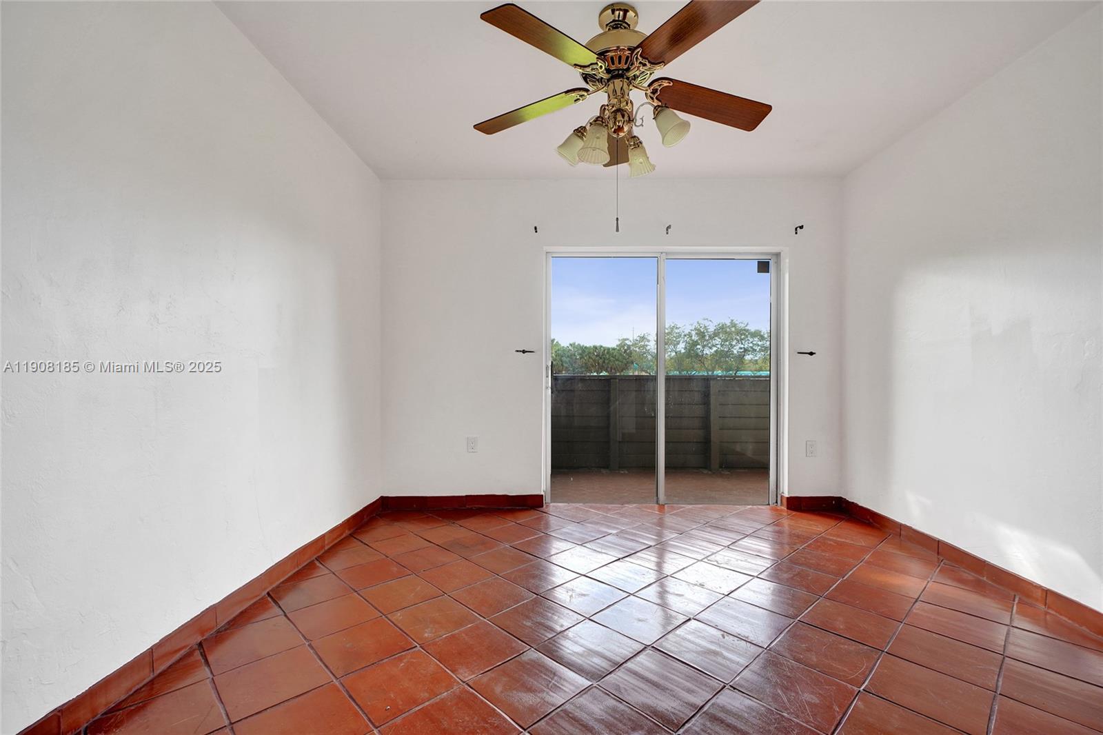 8335 Southwest 72nd Avenue, Unit 205D Miami, FL 33143 - Photo 9 of 19 wooden floor in an empty room with a window