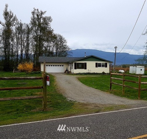 a view of a house with a big yard