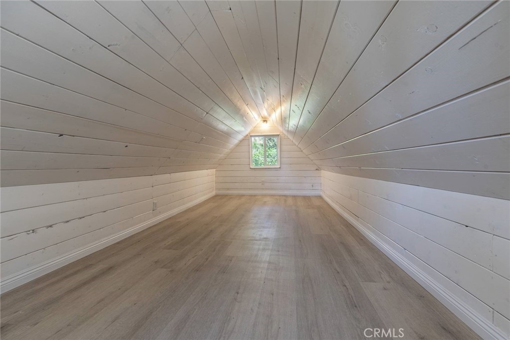 21818 Vista Road Cedarpines Park, CA 92322 - Photo 15 of 41 a view of empty room with wooden floor and fan