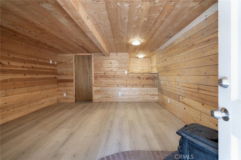 21818 Vista Road Cedarpines Park, CA 92322 - Photo 17 of 41 a view of a room with storage and racks on wall