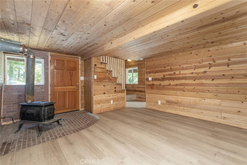 21818 Vista Road Cedarpines Park, CA 92322 - Photo 18 of 41 a view of walk in closet with clothes and shoes