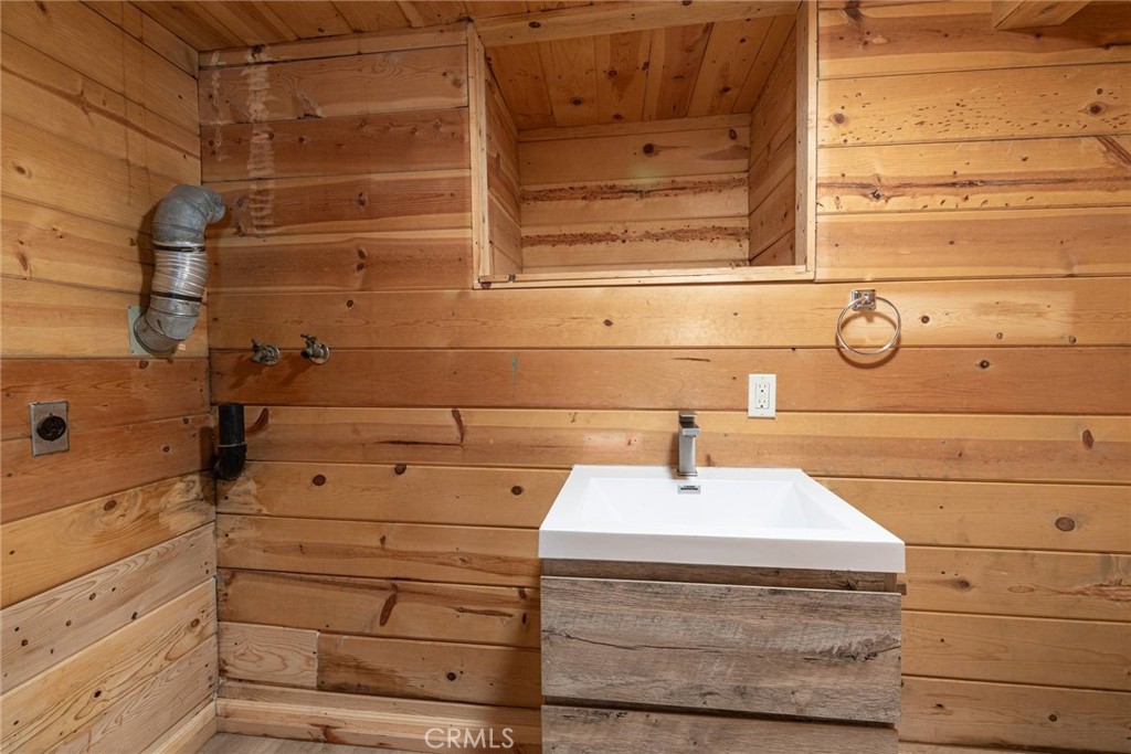 21818 Vista Road Cedarpines Park, CA 92322 - Photo 20 of 41 a bathroom with a sink and a mirror