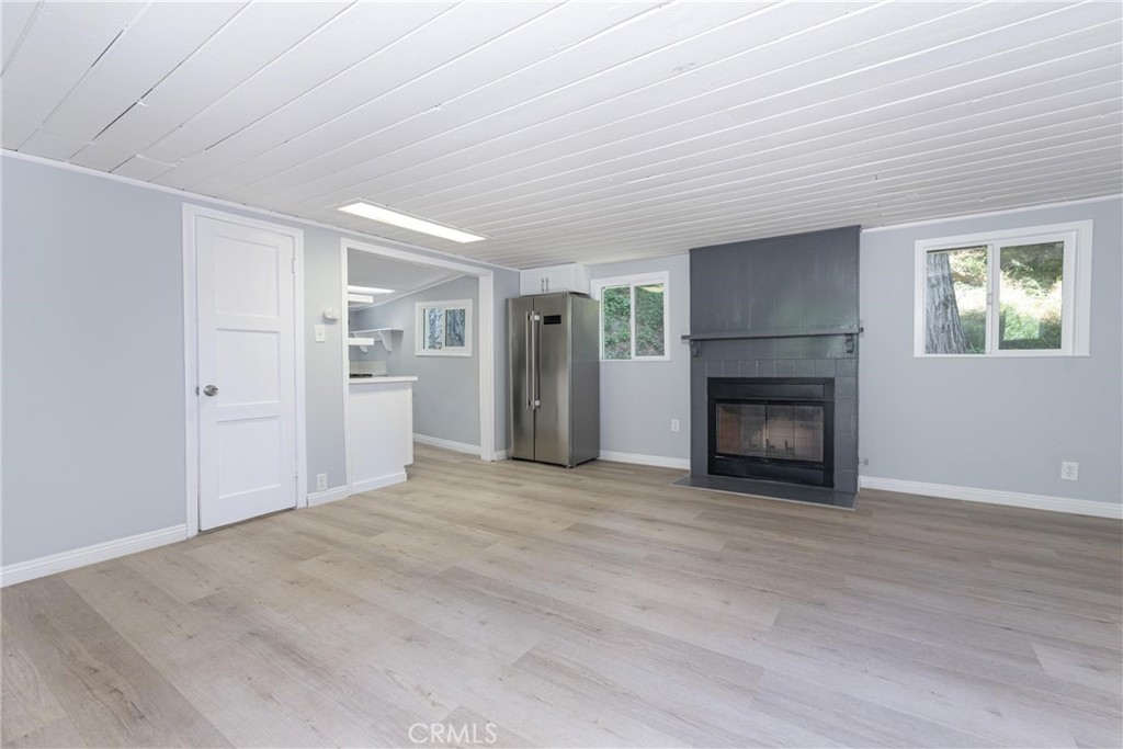 21818 Vista Road Cedarpines Park, CA 92322 - Photo 6 of 41 a view of empty room with a fireplace