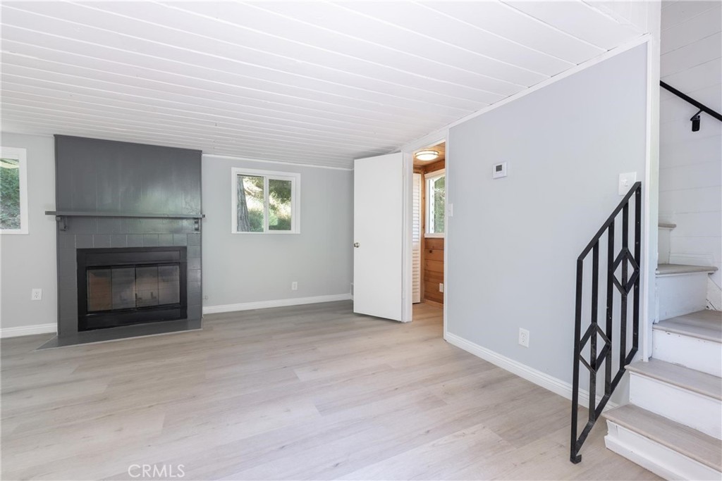21818 Vista Road Cedarpines Park, CA 92322 - Photo 7 of 41 a view of an empty room with window and fire place