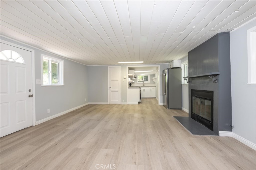 21818 Vista Road Cedarpines Park, CA 92322 - Photo 8 of 41 an empty room with windows and fireplace