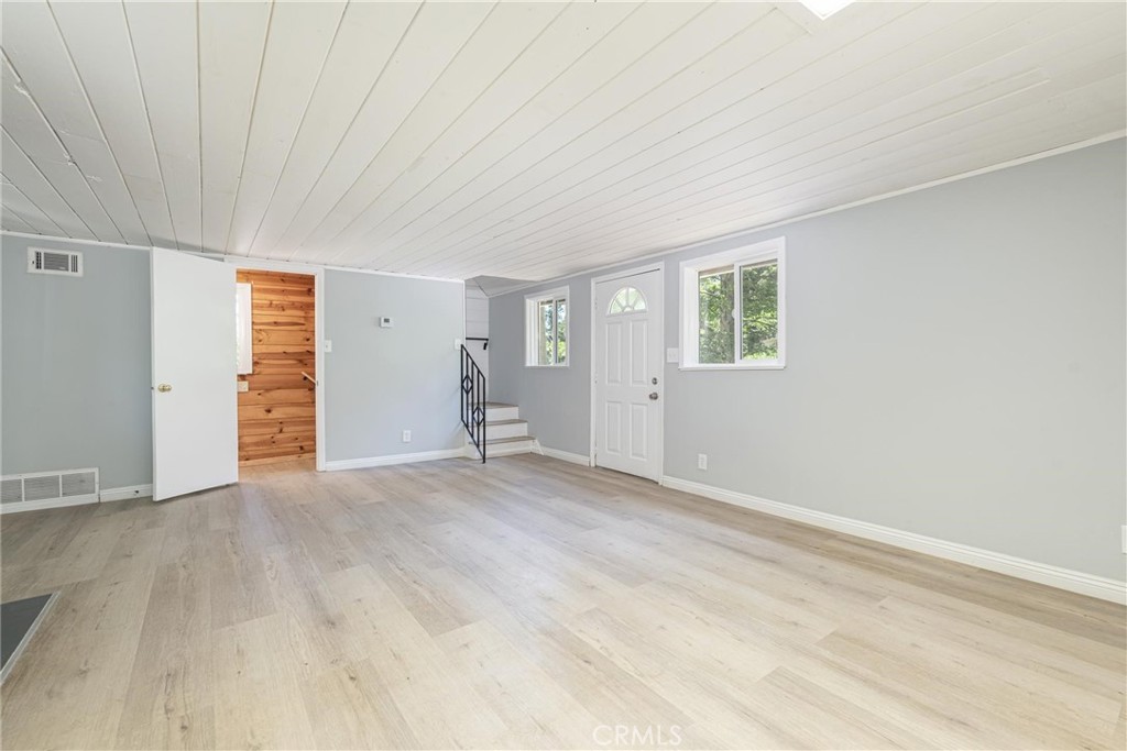 21818 Vista Road Cedarpines Park, CA 92322 - Photo 9 of 41 an empty room with windows and closet