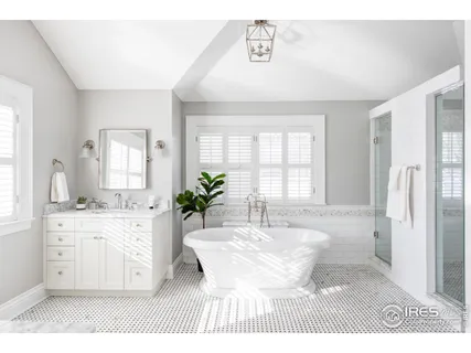 a view of a kitchen with a sink dishwasher a dining table with wooden floor