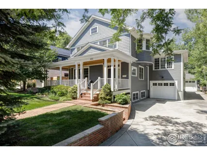 a view of a house with backyard porch and sitting area