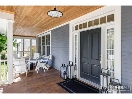 a view of a dining room with furniture wooden floor and a rug