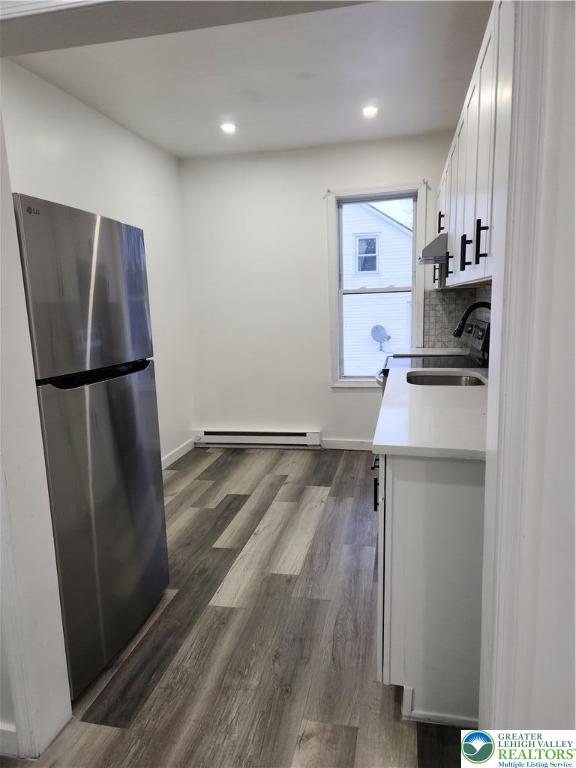 201 Ridge Avenue, Unit 2 Allentown, PA 18102 - Photo 3 of 15 a refrigerator freezer sitting inside of a kitchen