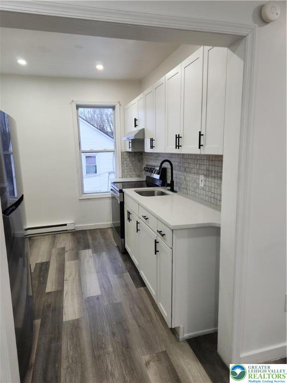 201 Ridge Avenue, Unit 2 Allentown, PA 18102 - Photo 4 of 15 a kitchen with a sink stove and cabinets