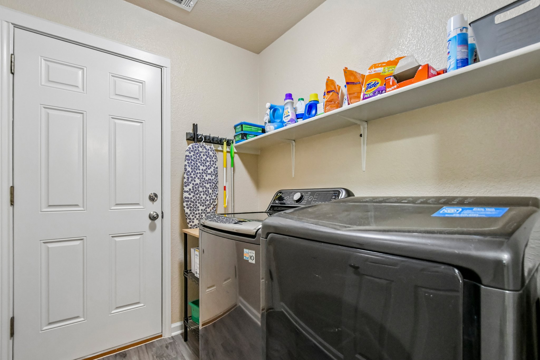 125 Mason Reed Cove Kyle, TX 78640 - Photo 27 of 39 a utility room with dryer and washer