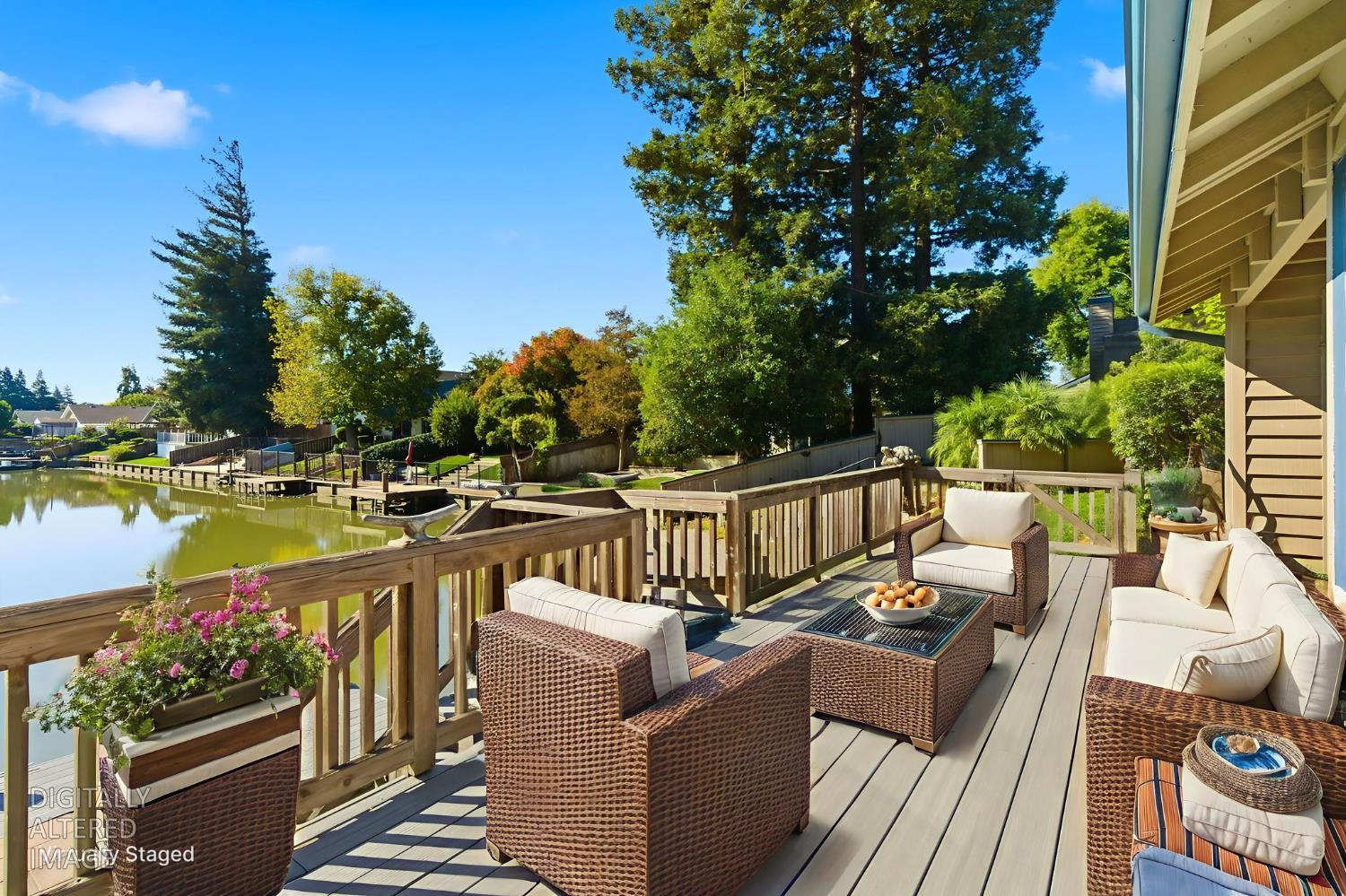 a view of a balcony with wooden floor and outdoor seating