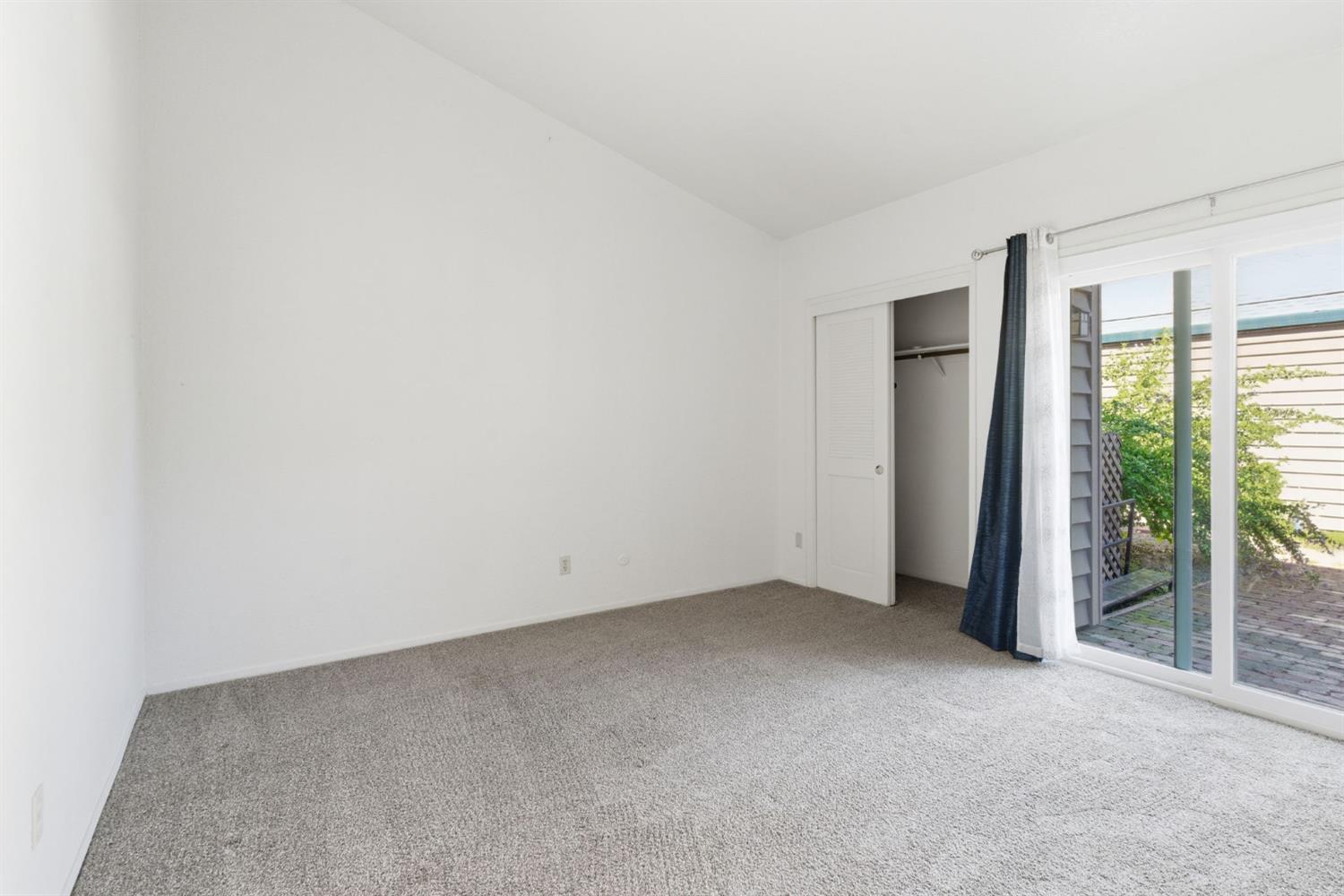 7348 Lighthouse Drive Stockton, CA 95219 - Photo 11 of 56 an empty room with windows