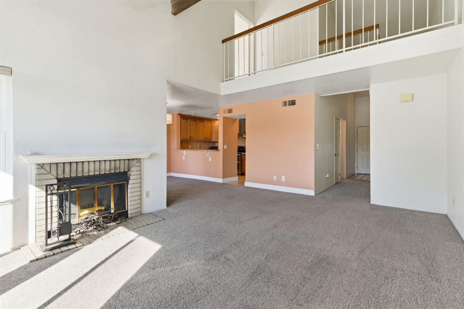 7348 Lighthouse Drive Stockton, CA 95219 - Photo 15 of 56 a view of a livingroom with a fireplace