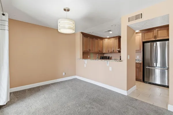 a kitchen with stainless steel appliances granite countertop a stove and a sink