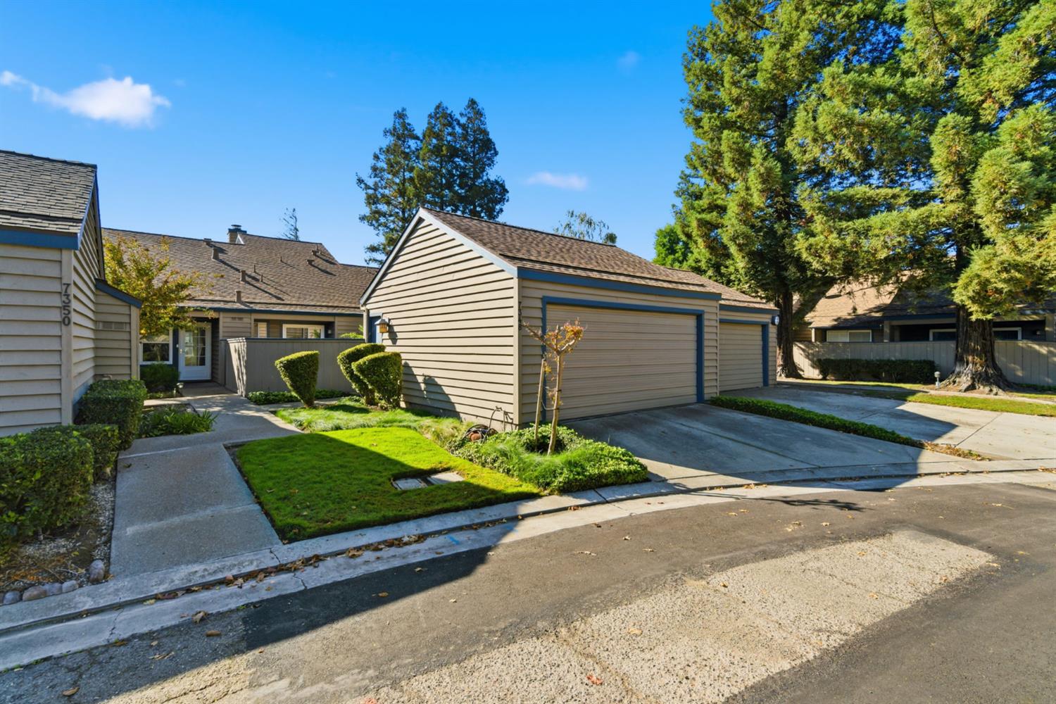 7348 Lighthouse Drive Stockton, CA 95219 - Photo 2 of 56 a front view of a house with a yard and garage