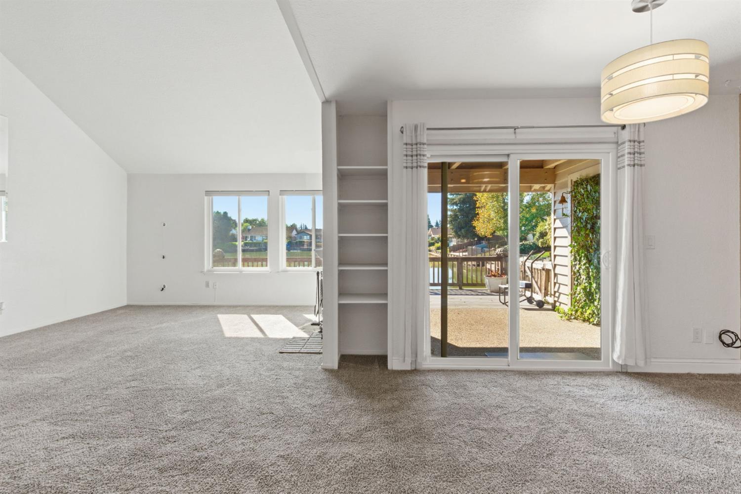 7348 Lighthouse Drive Stockton, CA 95219 - Photo 22 of 56 an empty room with windows and view of an empty room