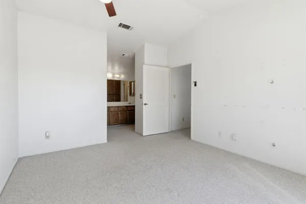 a bathroom with a shower and toilet