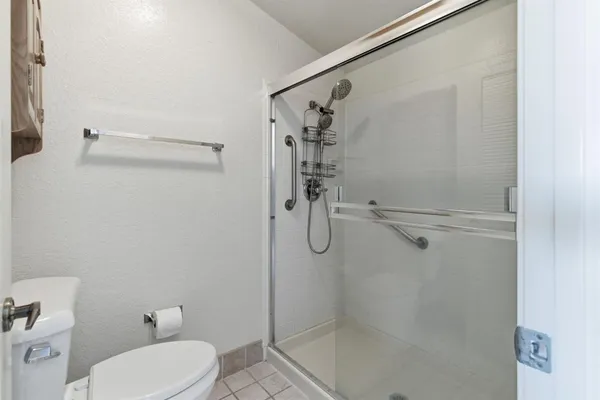 a view of balcony with wooden floor and fence