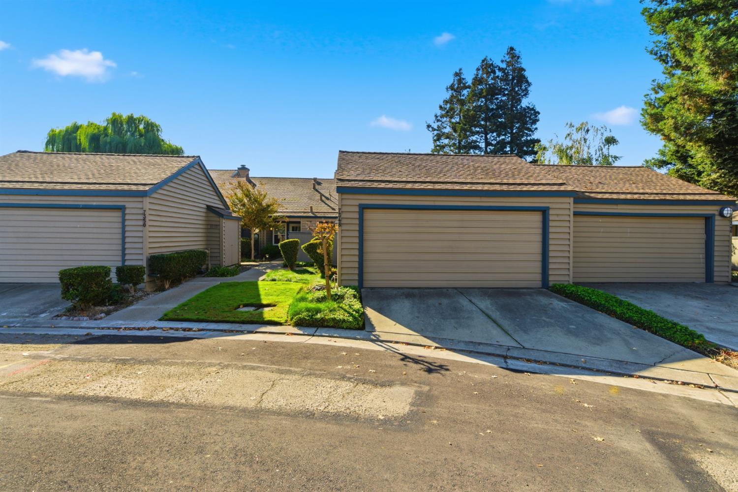 7348 Lighthouse Drive Stockton, CA 95219 - Photo 4 of 56 a front view of a house with a yard and garage