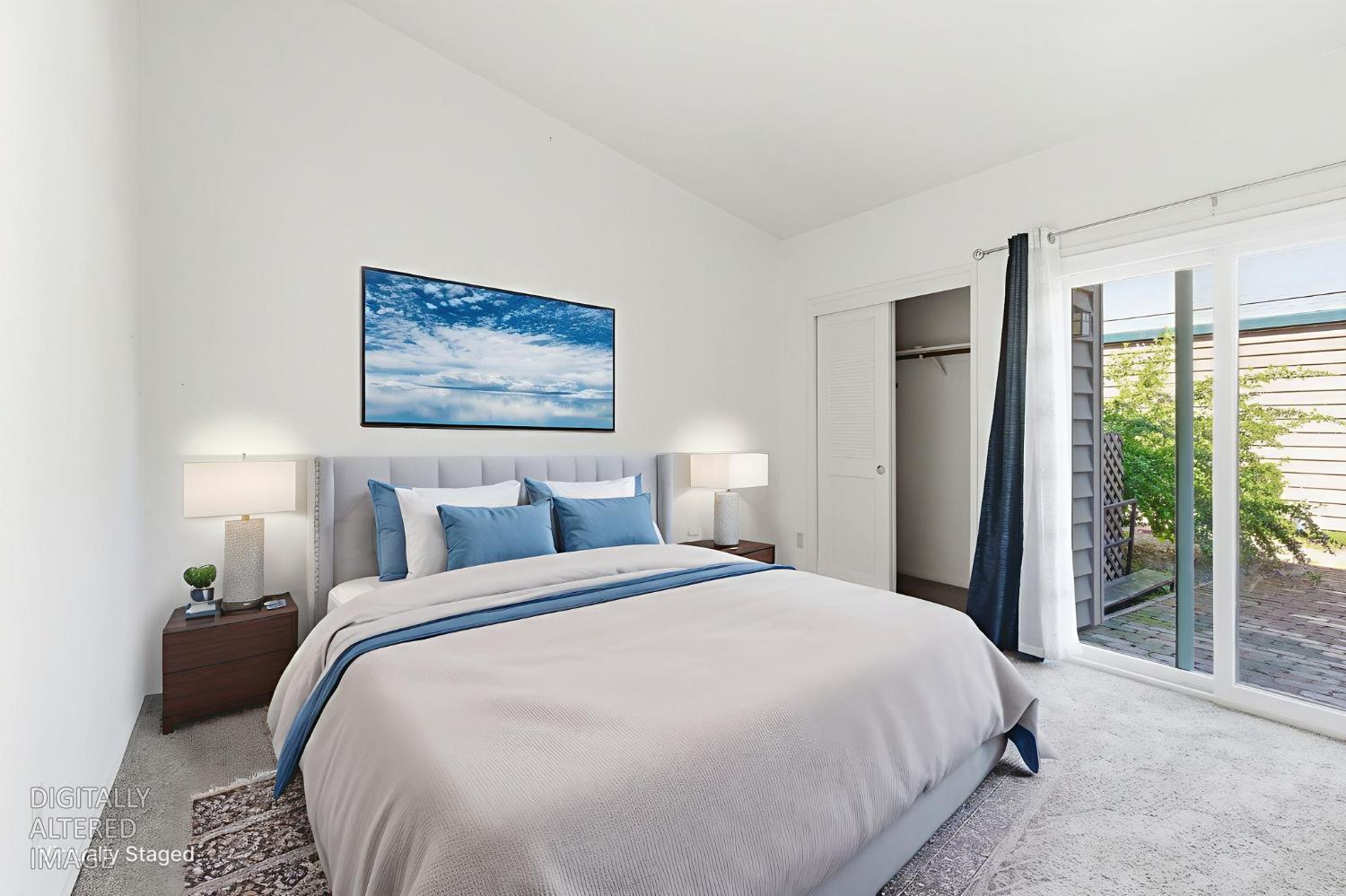 7348 Lighthouse Drive Stockton, CA 95219 - Photo 10 of 56 a large bed sitting in a bedroom next to a window