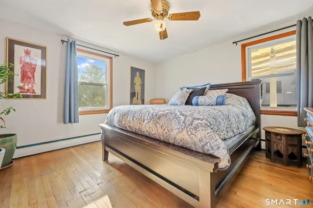 a bedroom with a bed and window