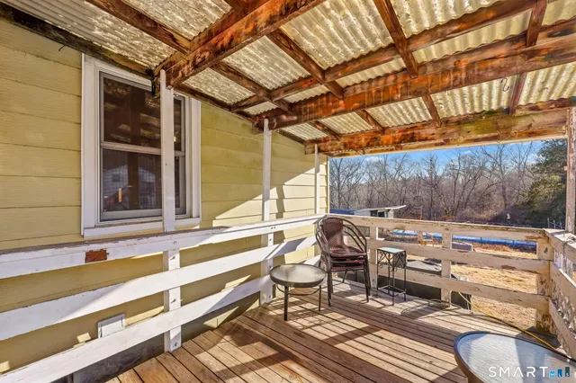 a view of a chairs and table in the patio