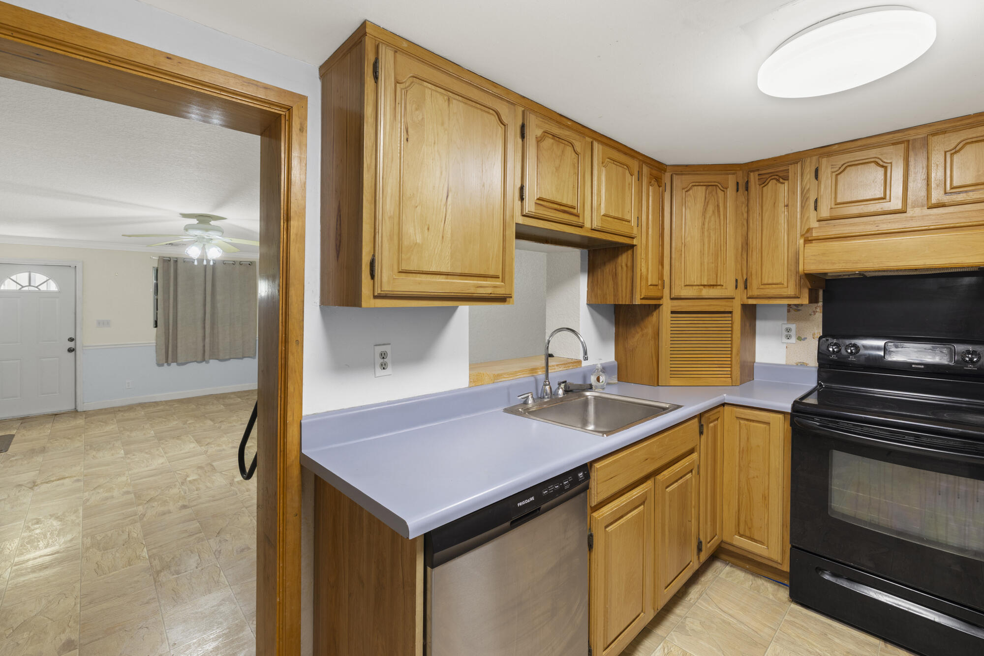 4838 Coconut Road Lake Worth, FL 33461 - Photo 20 of 42 Kitchen w/Pass Thru to Dinning Area