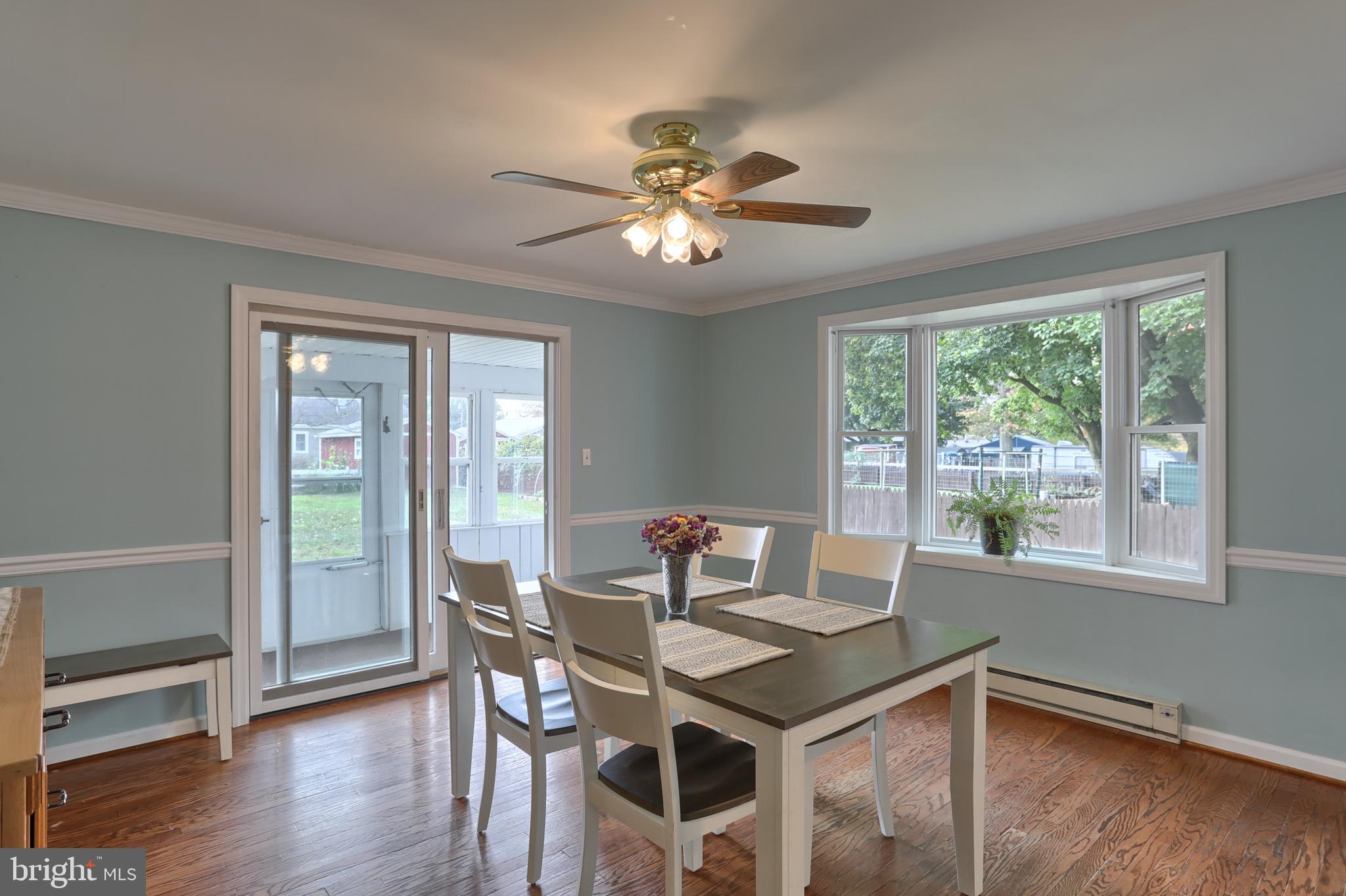 2569 Sheaffer Road Elizabethtown, PA 17022 - Photo 14 of 41 a view of a dining room with furniture window and wooden floor