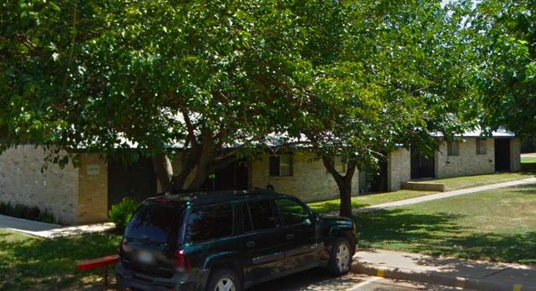 511 Merrill Street Mason, TX 76856 - Photo 2 of 6 a view of backyard with table and chairs and a large tree
