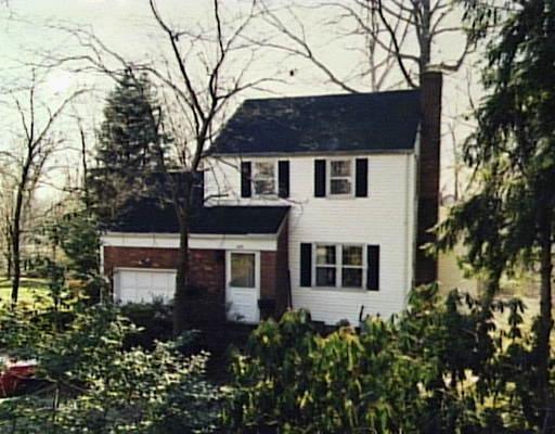 123 Knox Road Stamford, CT 06907 - Photo 1 of 1 a house that has a tree in front of it