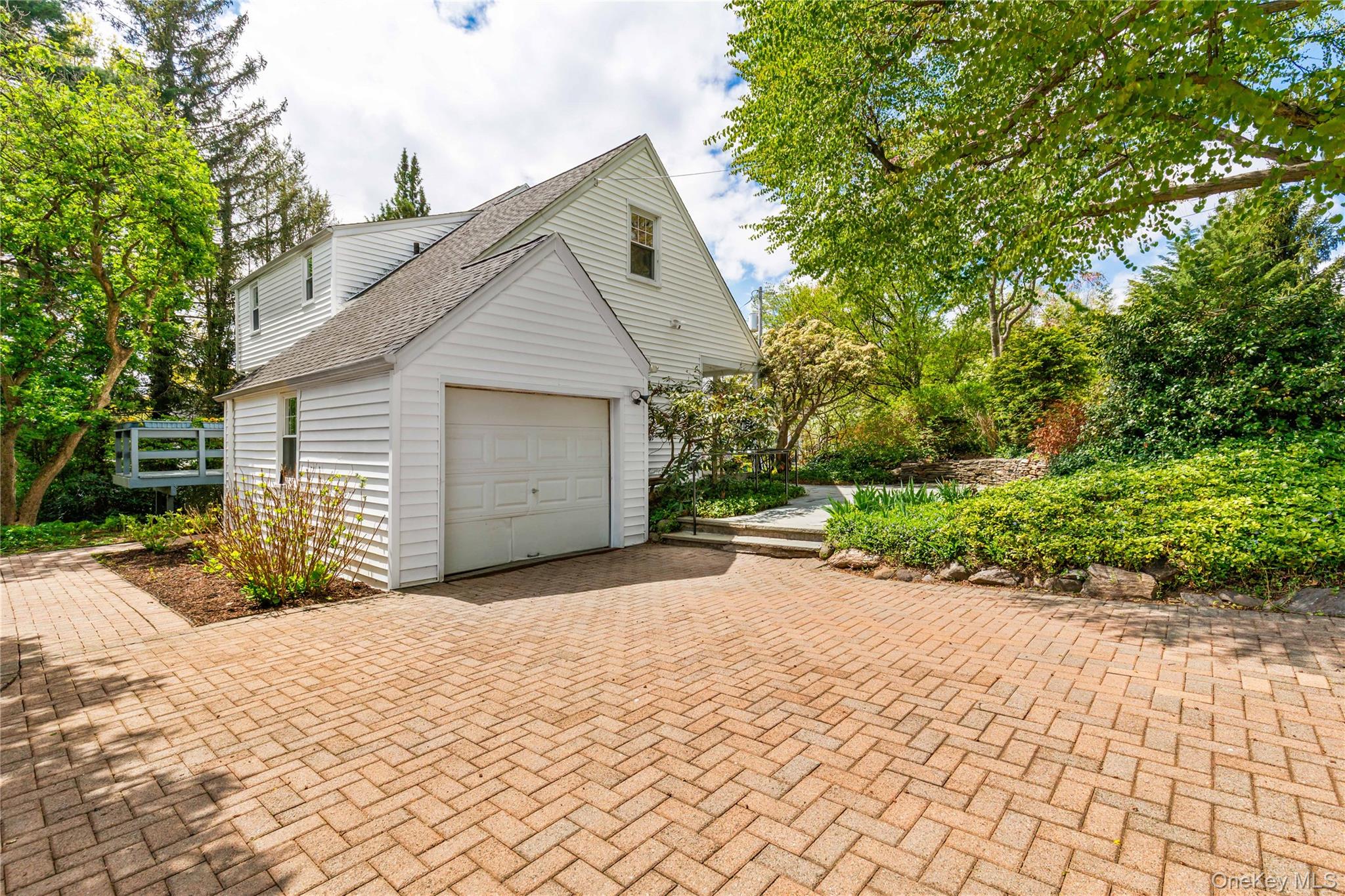 201 Clayton Road Scarsdale, NY 10583 - Photo 25 of 34 Driveway features attractive paver stones set in herringbone pattern.