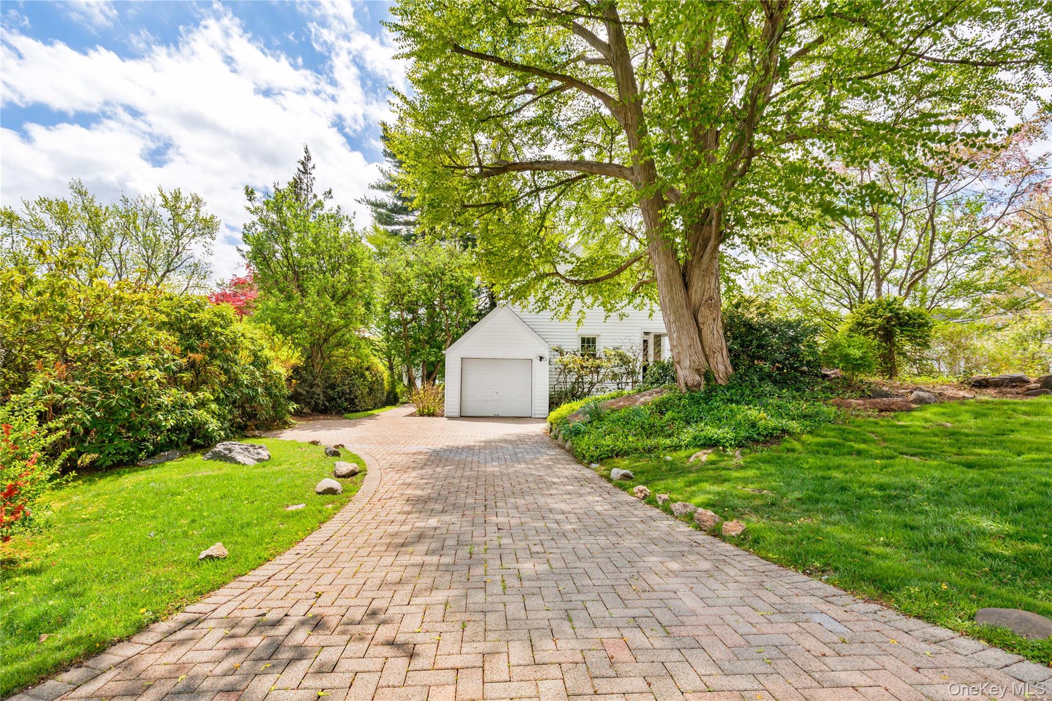 201 Clayton Road Scarsdale, NY 10583 - Photo 26 of 34 Alternate view of paver stone driveway. One car, attached garage and driveway provide plenty of off-road parking.