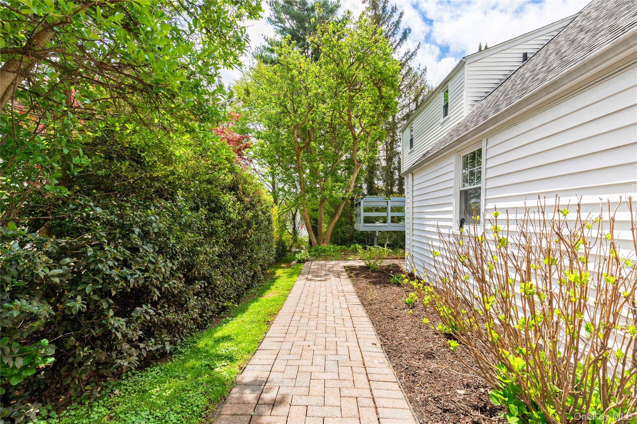 201 Clayton Road Scarsdale, NY 10583 - Photo 27 of 34 Stone path provides easy access from garage to rear property.