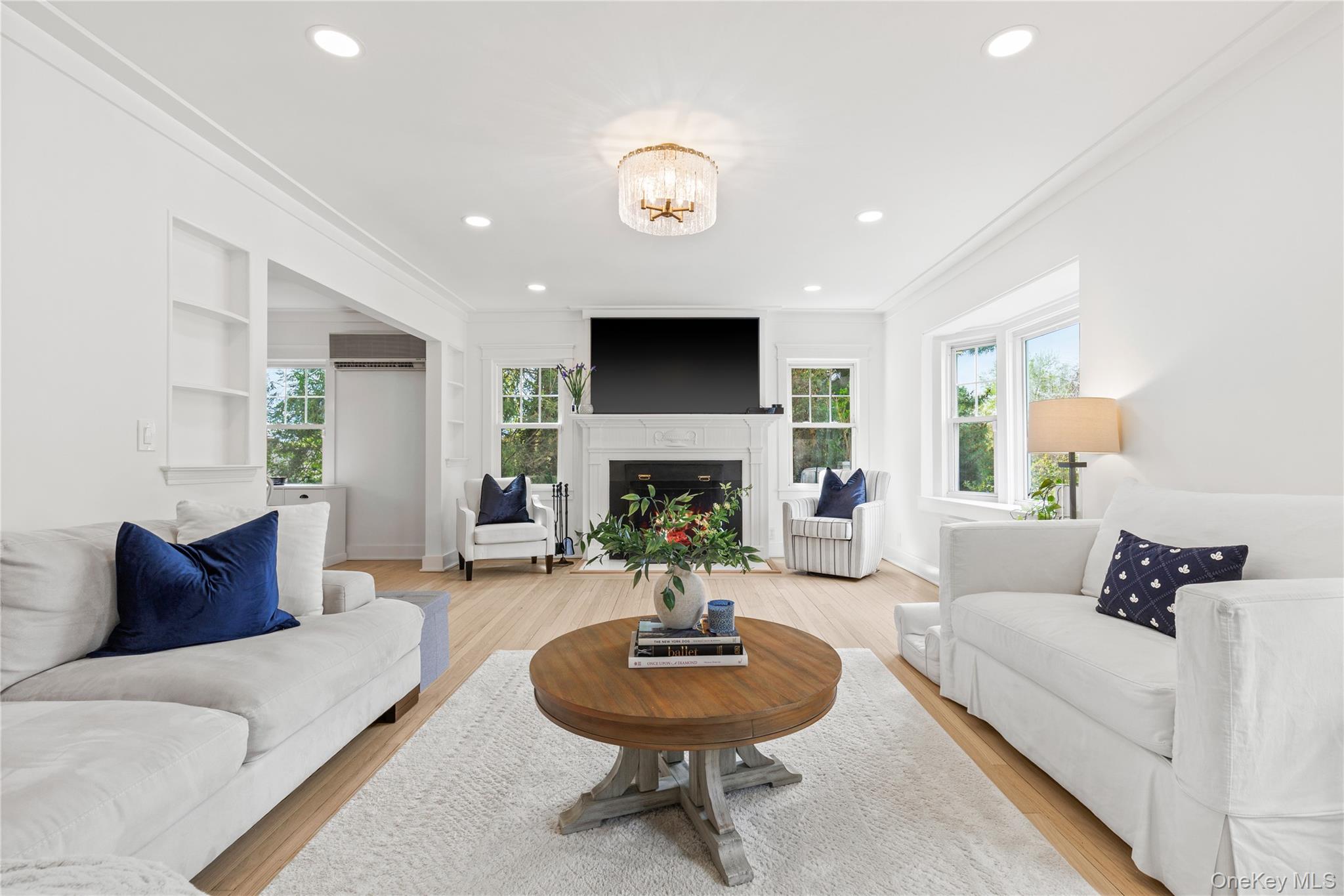 201 Clayton Road Scarsdale, NY 10583 - Photo 7 of 34 Living Room has new LED lighting and statement glass chandelier.