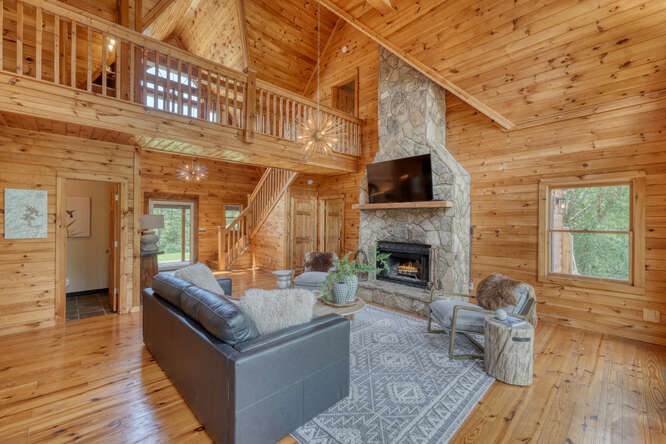 514 Browns Cove Road Blue Ridge, GA 30513 - Photo 11 of 77 a living room with furniture and a fireplace