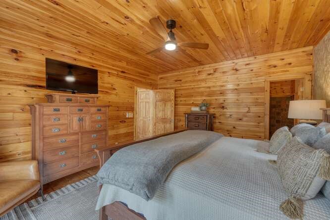 514 Browns Cove Road Blue Ridge, GA 30513 - Photo 24 of 77 a bed room with a bed and flat screen tv