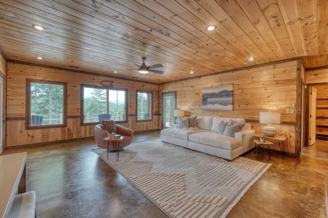 514 Browns Cove Road Blue Ridge, GA 30513 - Photo 36 of 77 a living room with furniture and a large window