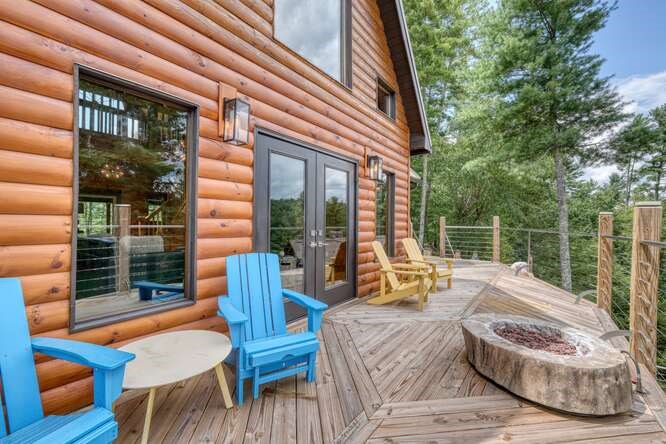 514 Browns Cove Road Blue Ridge, GA 30513 - Photo 48 of 77 a view of a patio with a table chairs and a backyard
