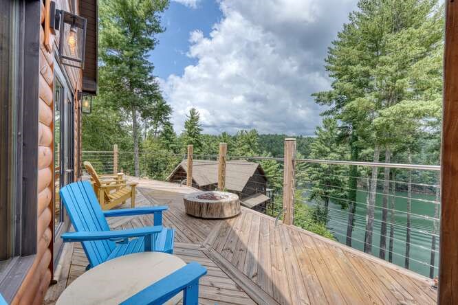 514 Browns Cove Road Blue Ridge, GA 30513 - Photo 50 of 77 a view of a chair and tables in the balcony