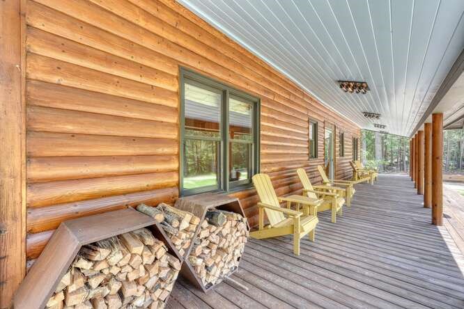 514 Browns Cove Road Blue Ridge, GA 30513 - Photo 6 of 77 a balcony with chairs and wooden floor